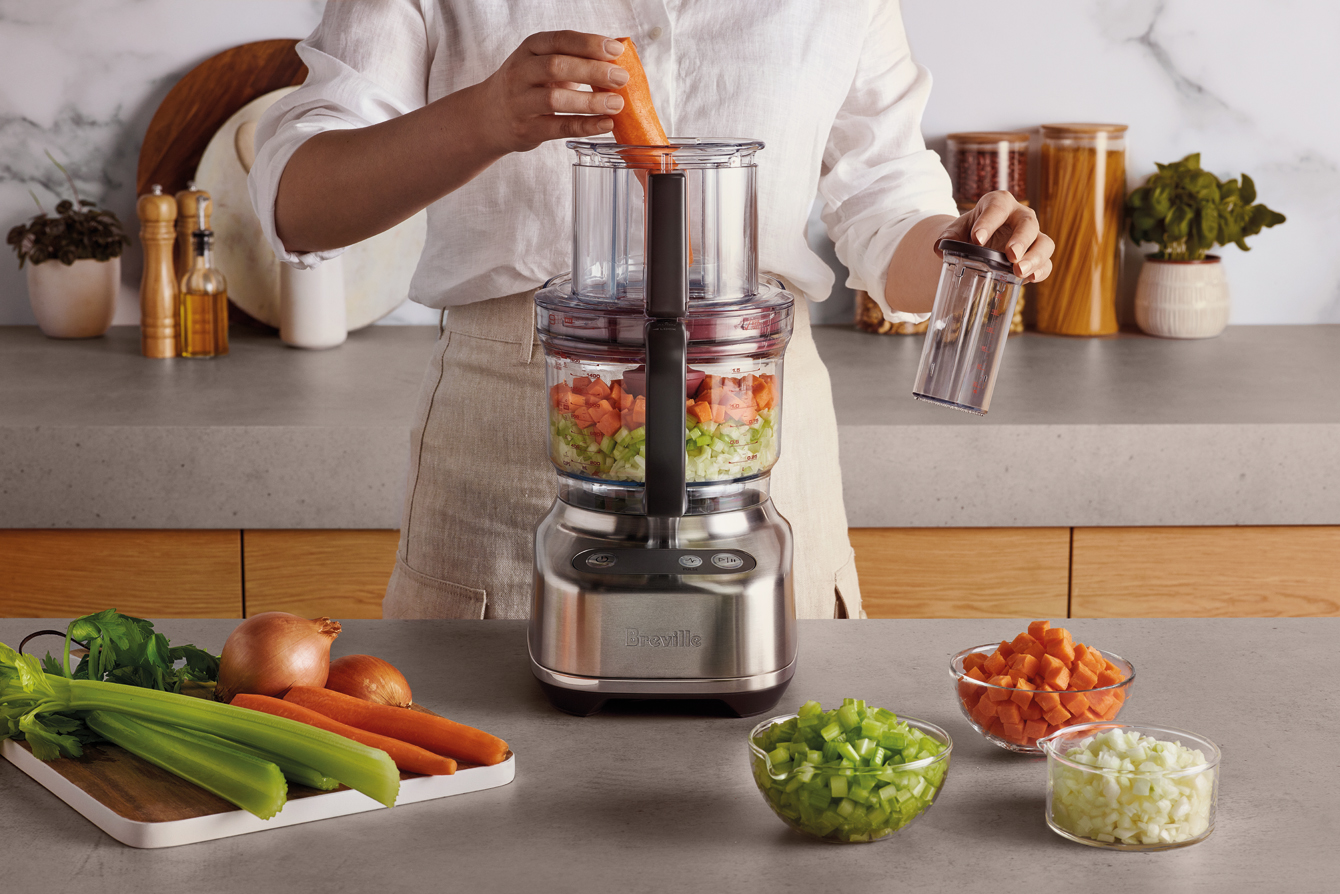 Sliced veggies in the food processor bowl